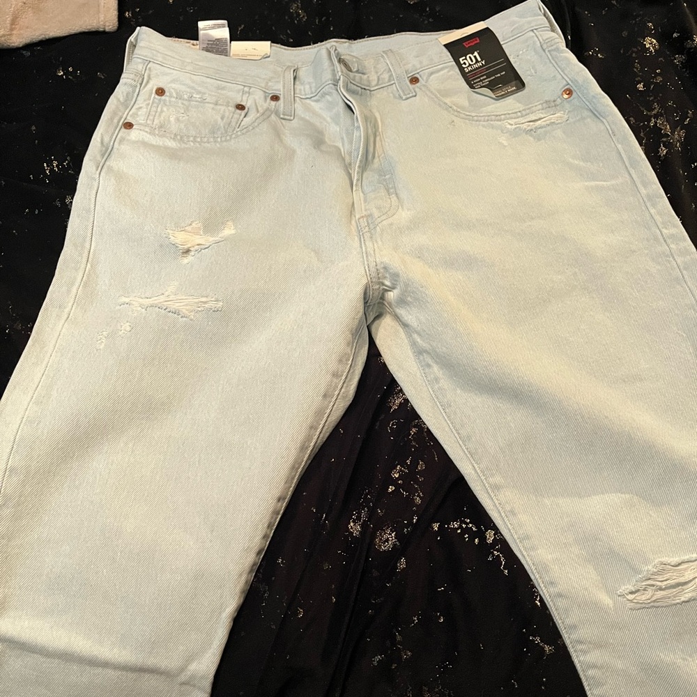 Levi's women’s 501 Light Blue Straight Distressed Jean’s